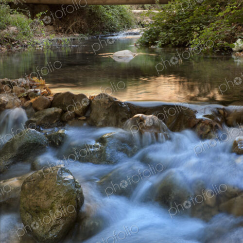 Kziv River Flowing Over Rocks