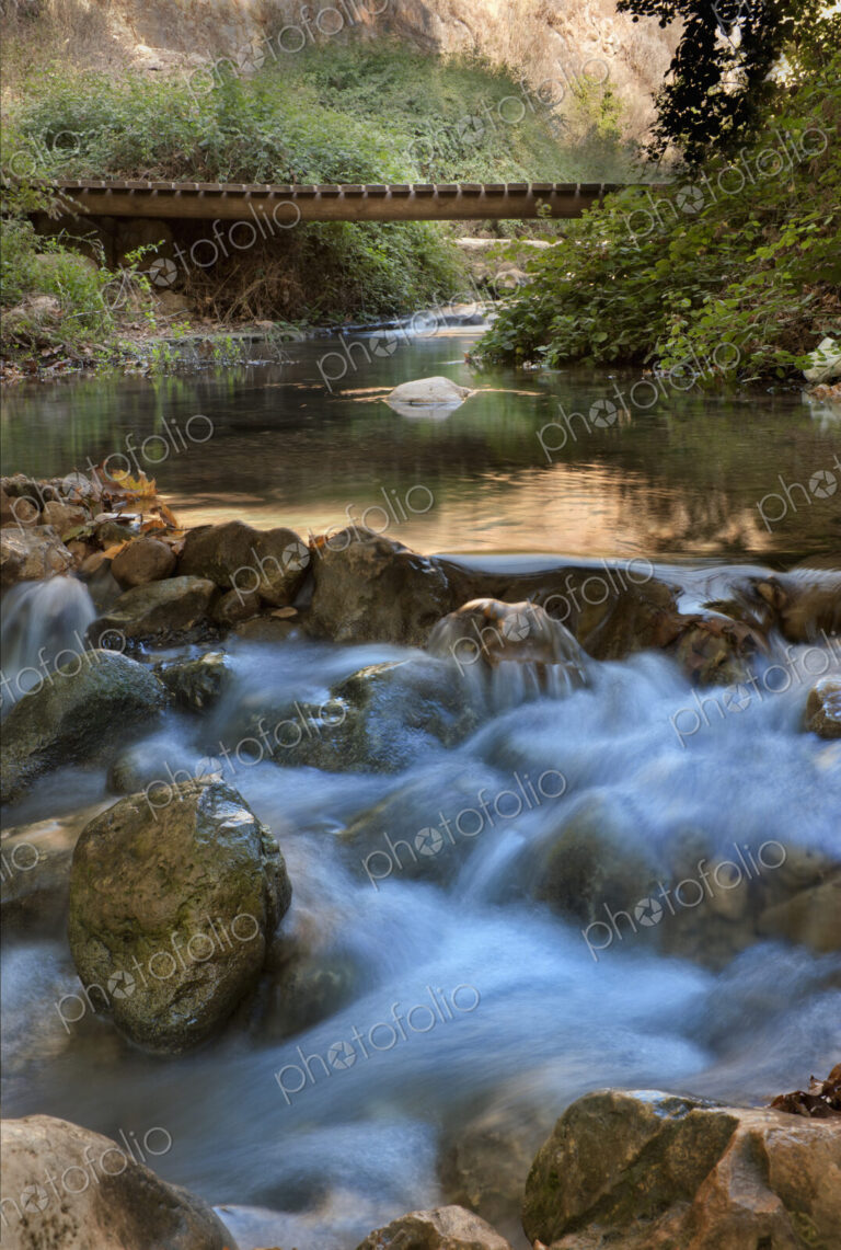 Kziv River Flowing Over Rocks