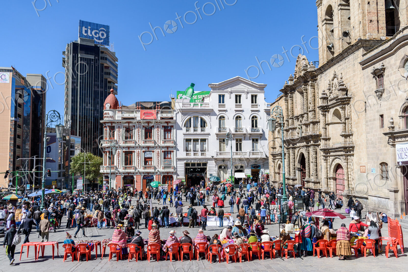 La Paz, a city square, a large group of people at market stalls outside the large…