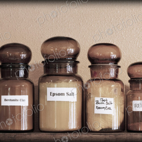 Labelled jars of remedies on shelves in an apothecary shop. Labelled jars of remedies on shelves in an apothecary shop.