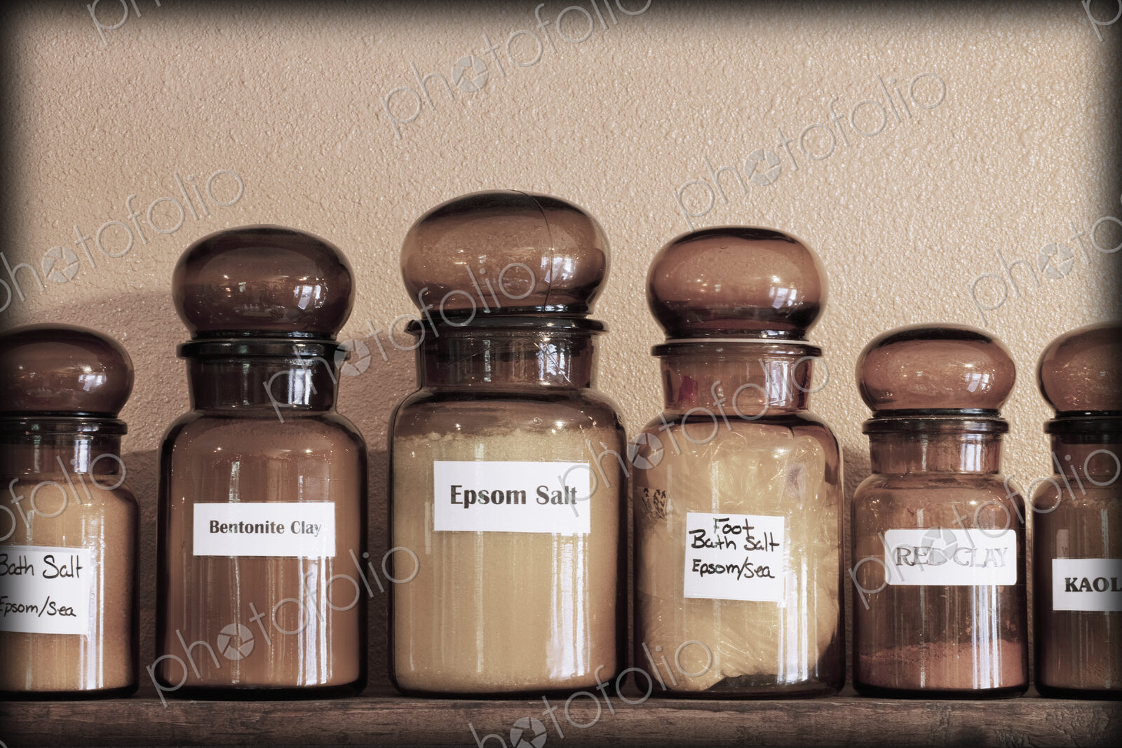 Labelled jars of remedies on shelves in an apothecary shop.