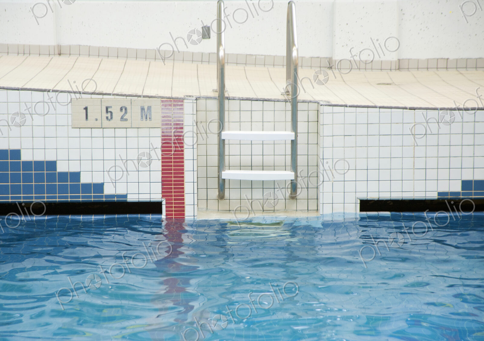 Ladder Going Into a Public Swimming Pool