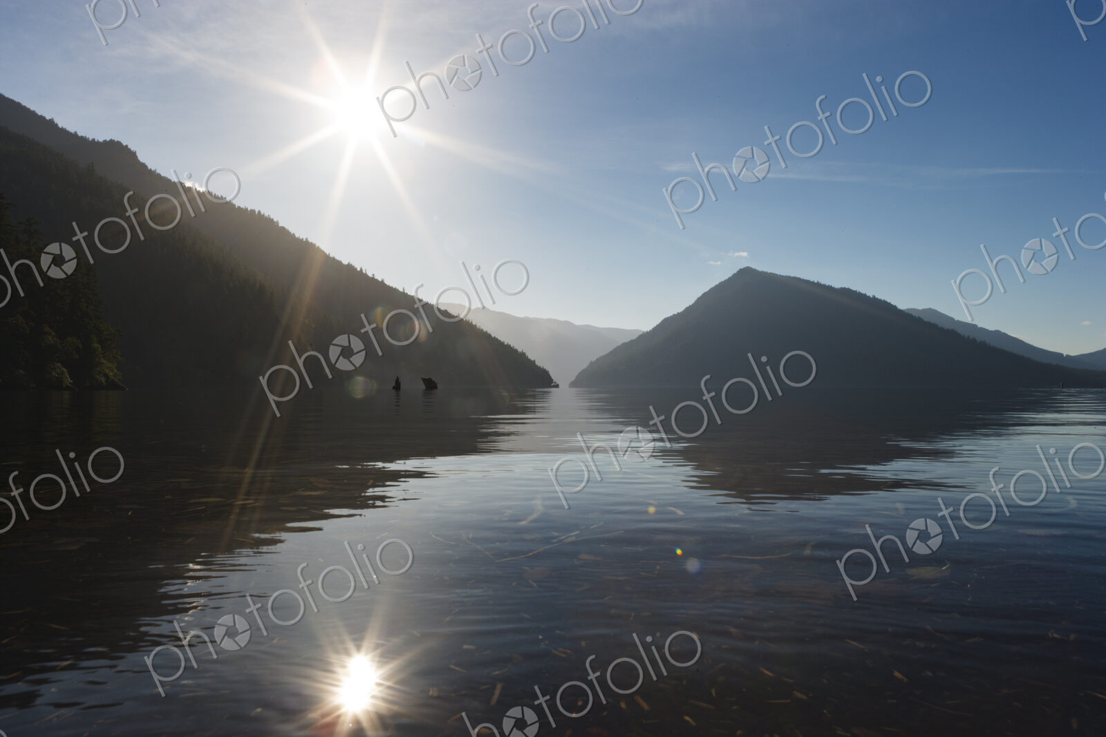 Lake Crescent, Olympic National Park, lens flare, sun in the sky above the water,…