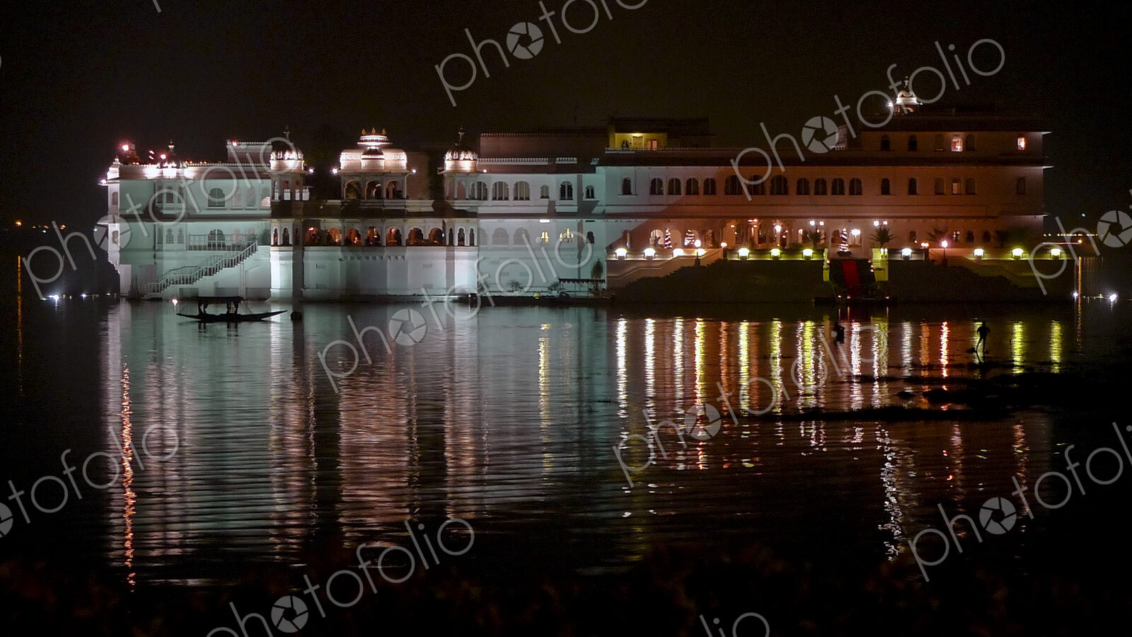 Lake Palace at Night With Lights Reflecting in Water