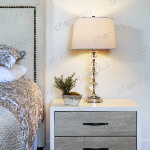 Lamp and bedside table in bedroom Lamp and bedside table in bedroom