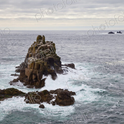 Land's End, rock islets offshore, the Penwith peninsula, view to a lighthouse and out…