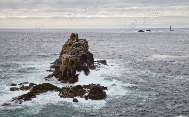 Land's End, rock islets offshore, the Penwith peninsula, view to a lighthouse and out…