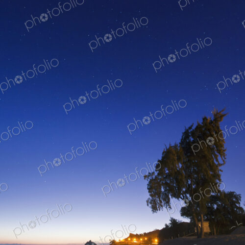 Lanikai Beach at dawn, view along the beach, trees and coastline. Lanikai Beach at dawn, view along the beach, trees and coastline.