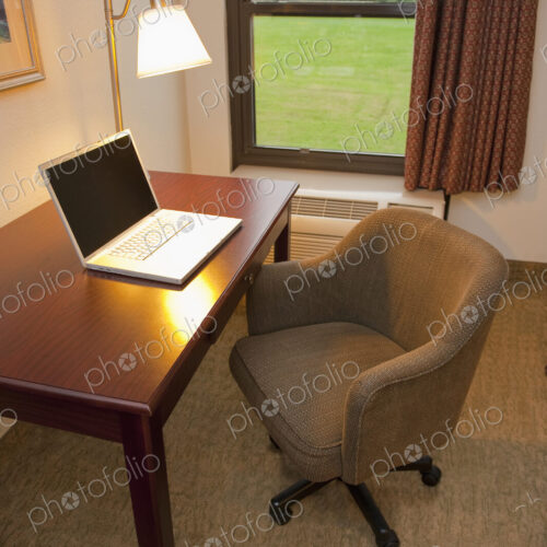 Laptop on a Hotel Room Desk Laptop on a Hotel Room Desk