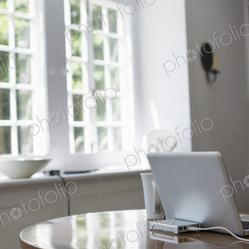 Laptop on a table in a home office. Laptop on a table in a home office.