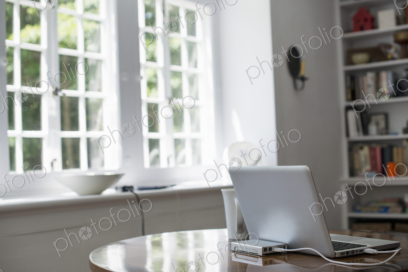 Laptop on a table in a home office.