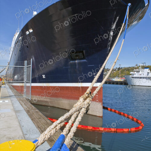 Large Ship Docked With Ropes Large Ship Docked With Ropes