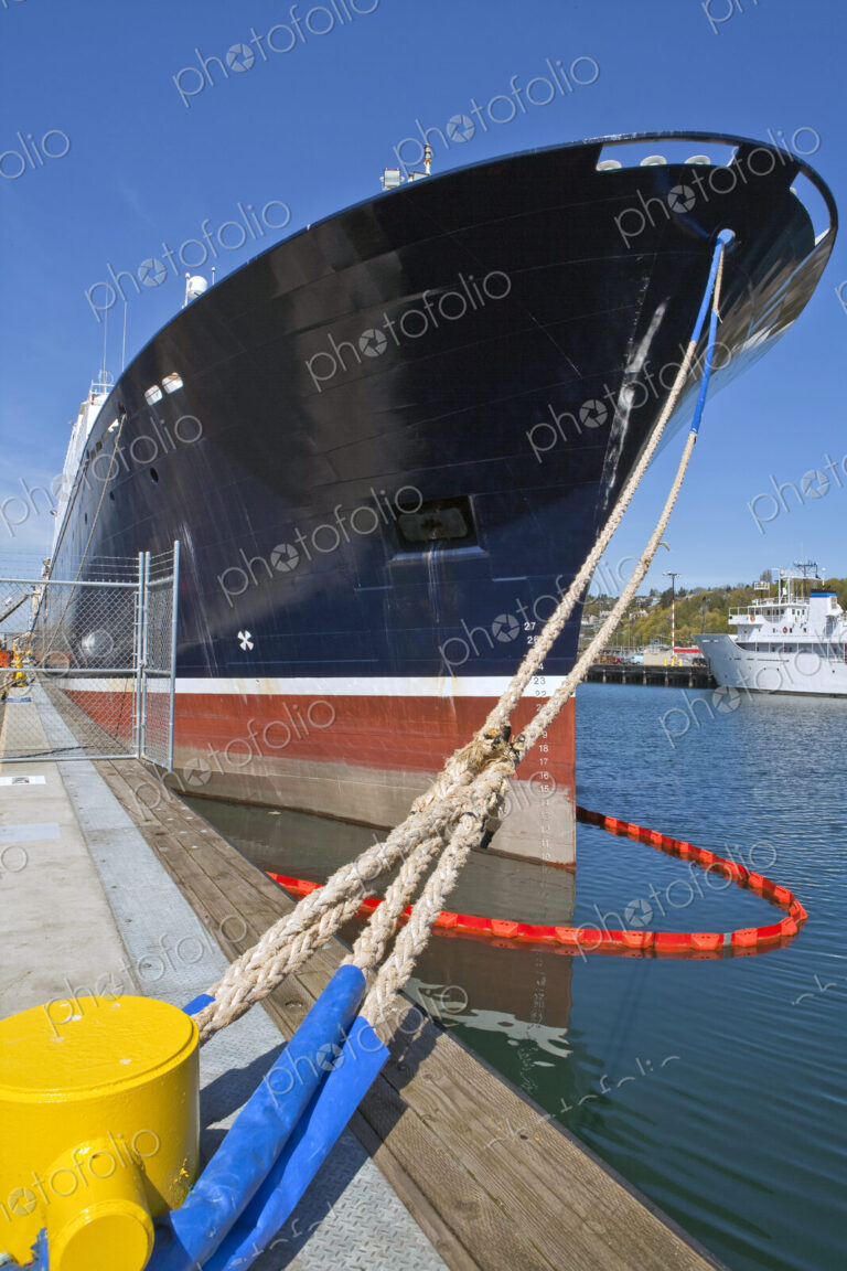Large Ship Docked With Ropes