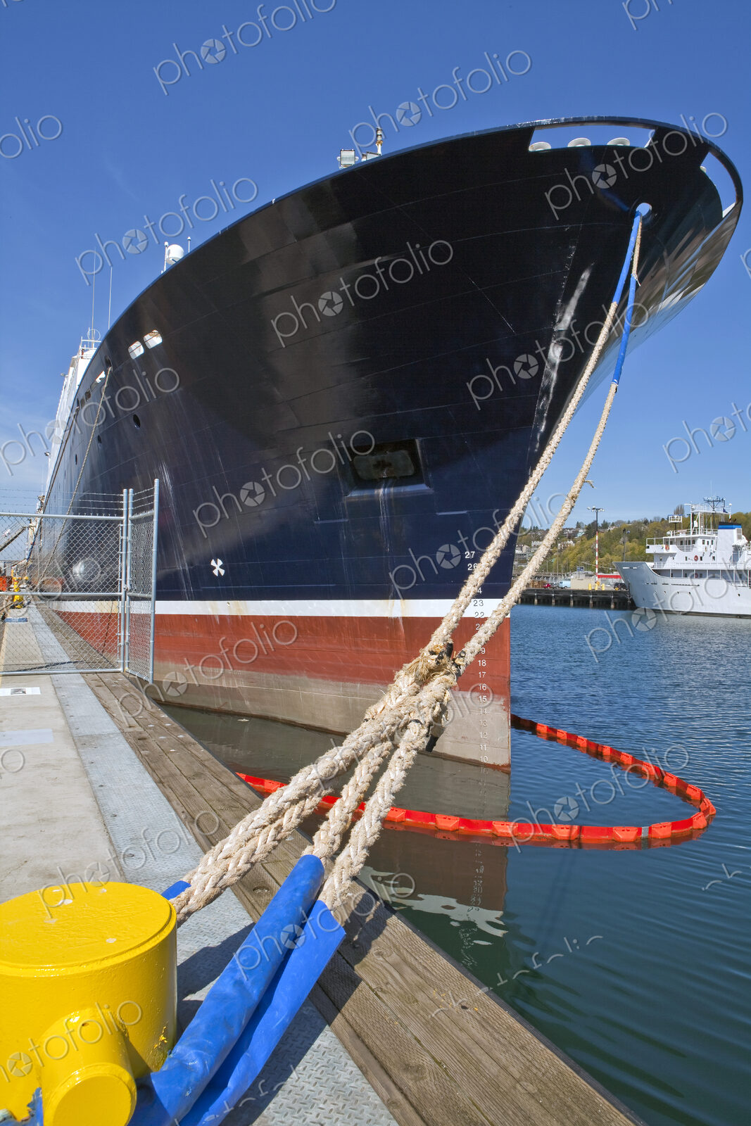 Large Ship Docked With Ropes