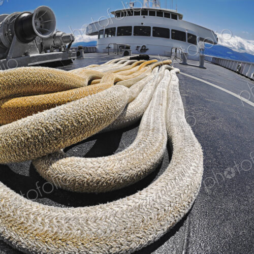 Large and thick cables, ropes on a deck of passenger ferry.