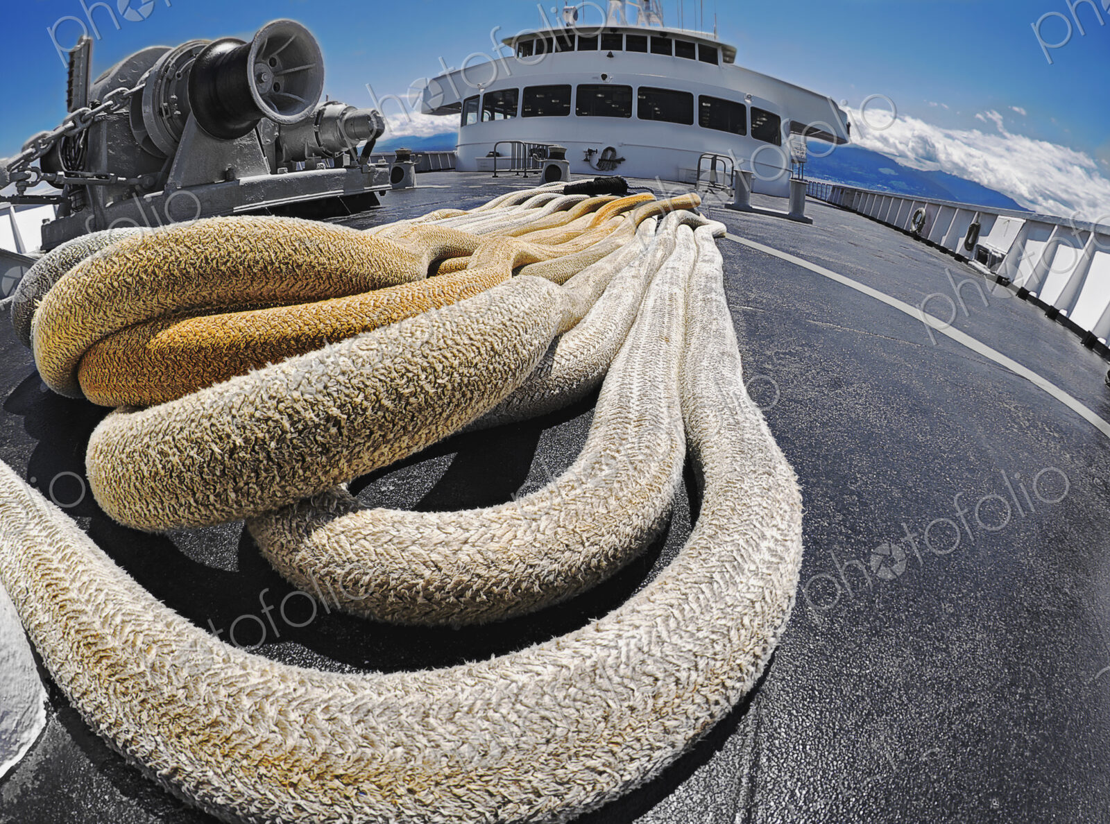 Large and thick cables, ropes on a deck of passenger ferry.