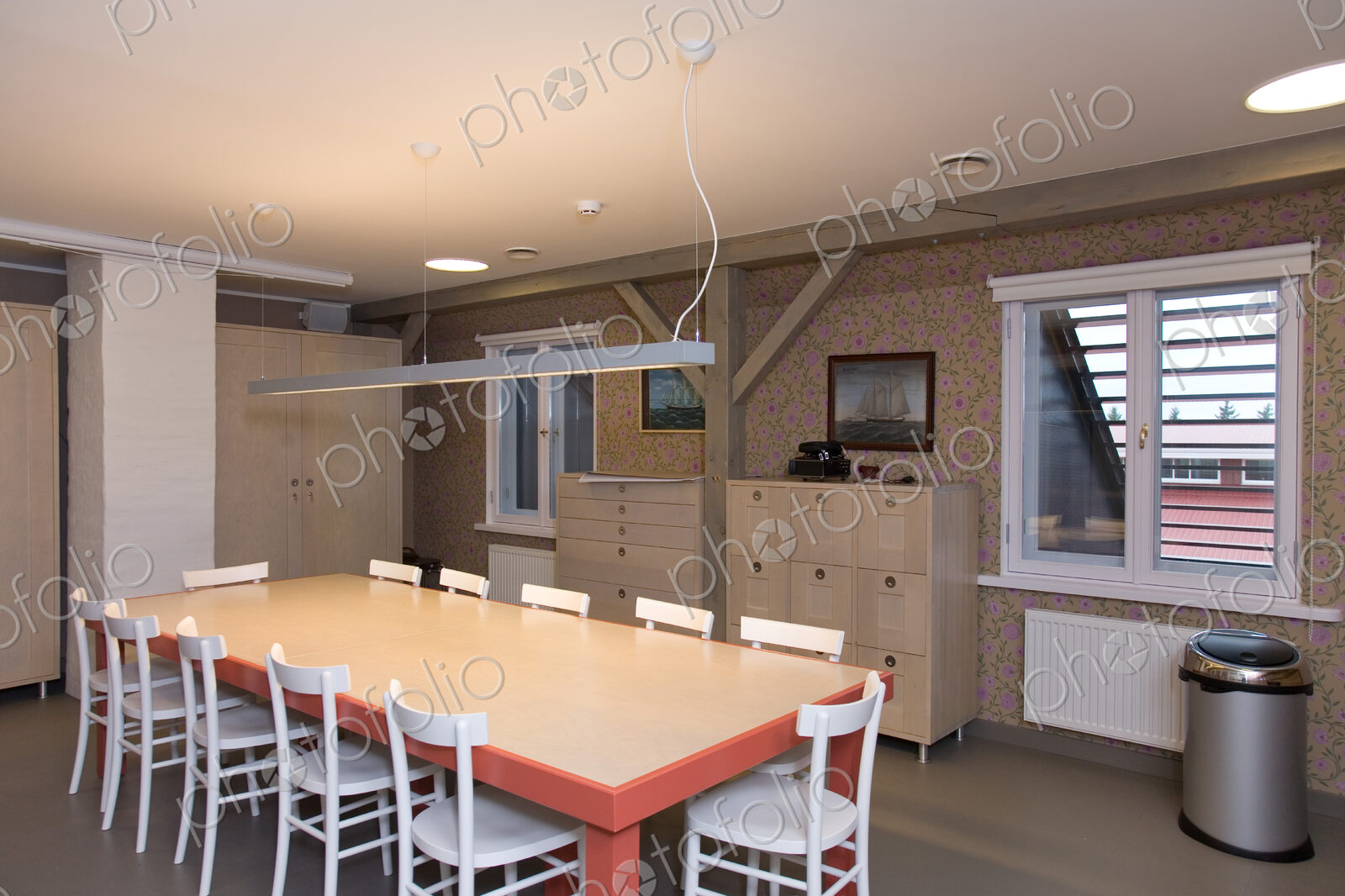 Large dining table with chairrs in apartment.