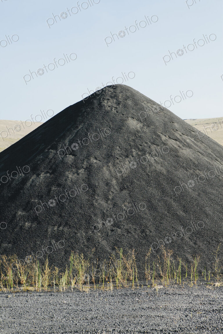 Large gravel pile used for road construction and maintenance