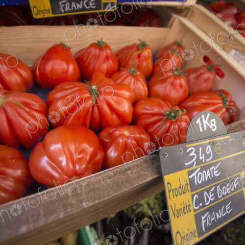 Large heirloom tomatoes at a market stall in Bonifacio on Corsica.