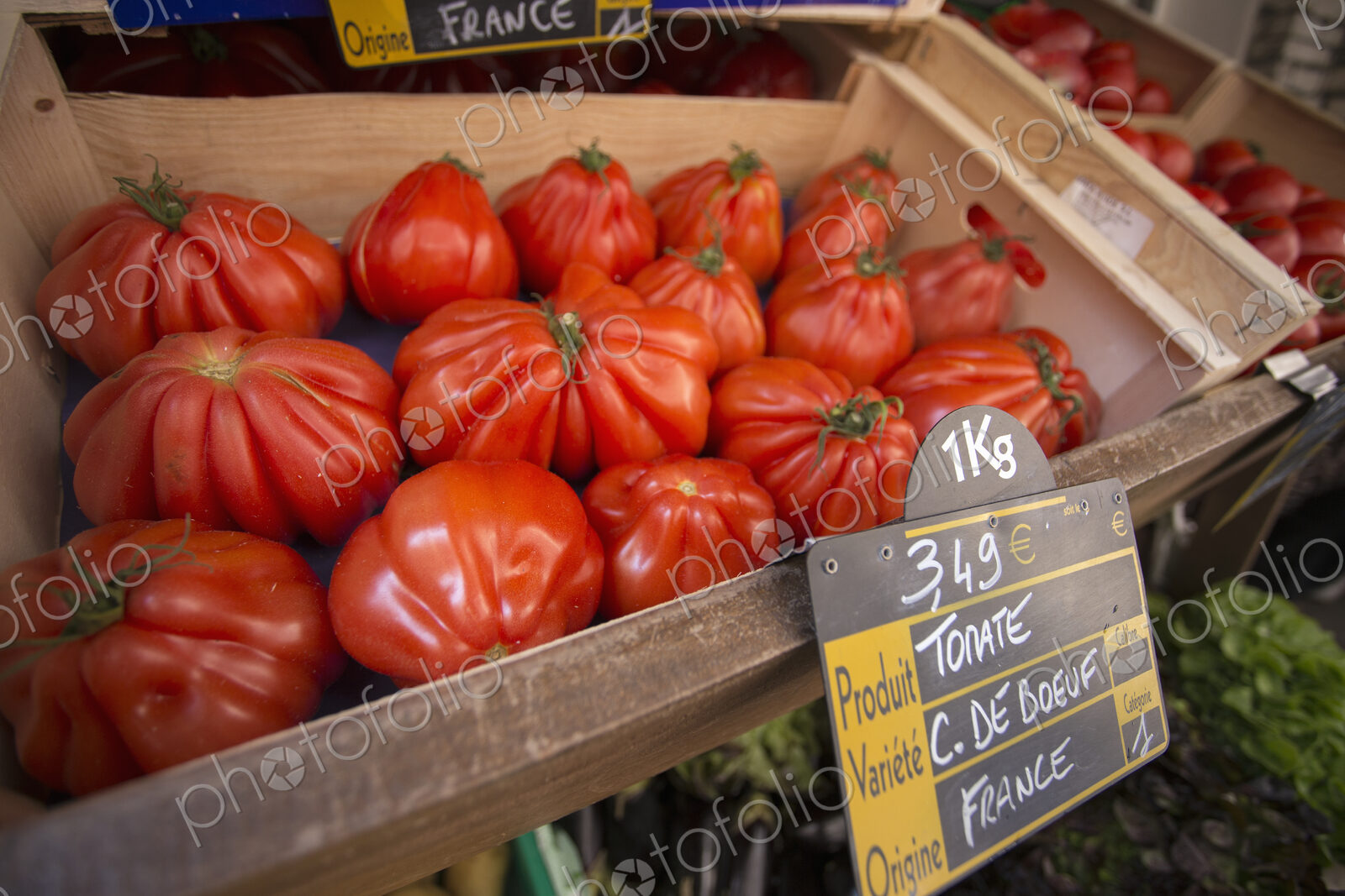 Large heirloom tomatoes at a market stall in Bonifacio on Corsica.