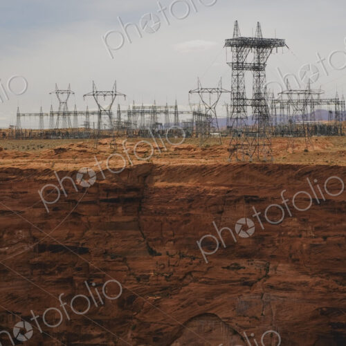 Large power lines on pylons crossing a canyon in Arizona, reaching into the distance. Large power lines on pylons crossing a canyon in Arizona, reaching into the distance.
