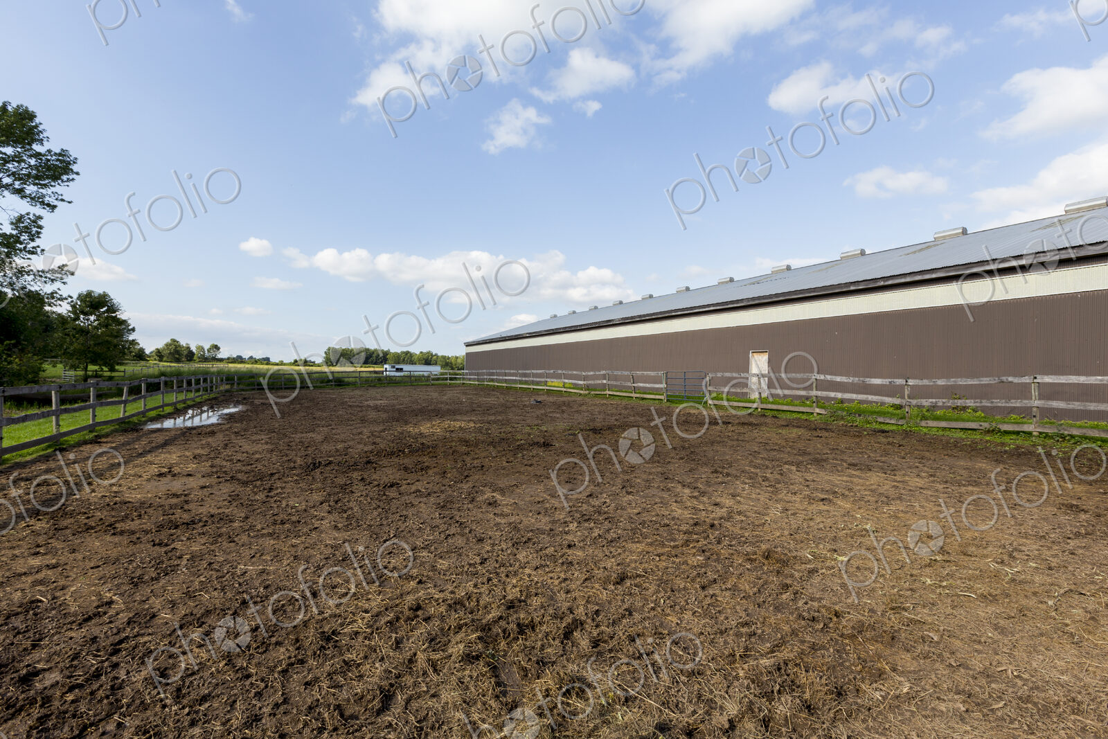 Large rural building and paddock in the country.