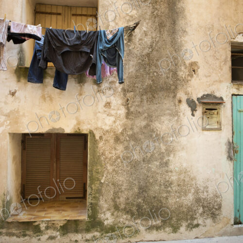 Laundry drying on a washing line outside a house in Bonifacio on Corsica.