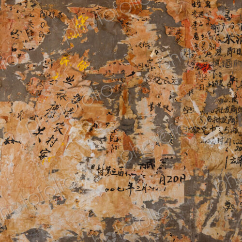 Layers of paper peeling off a wall, Kunming, China Layers of paper peeling off a wall, Kunming, China