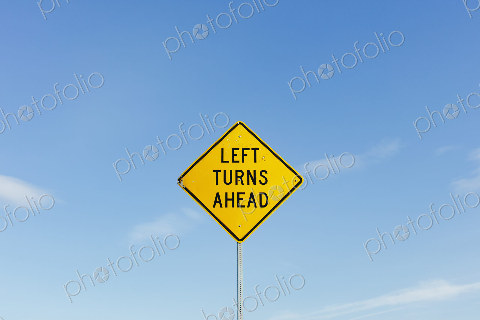 Left Turns Ahead yelloow traffic sign