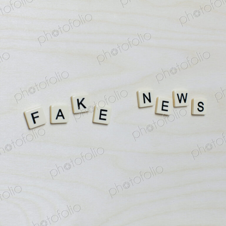 Letter blocks spelling "FAKE NEWS"