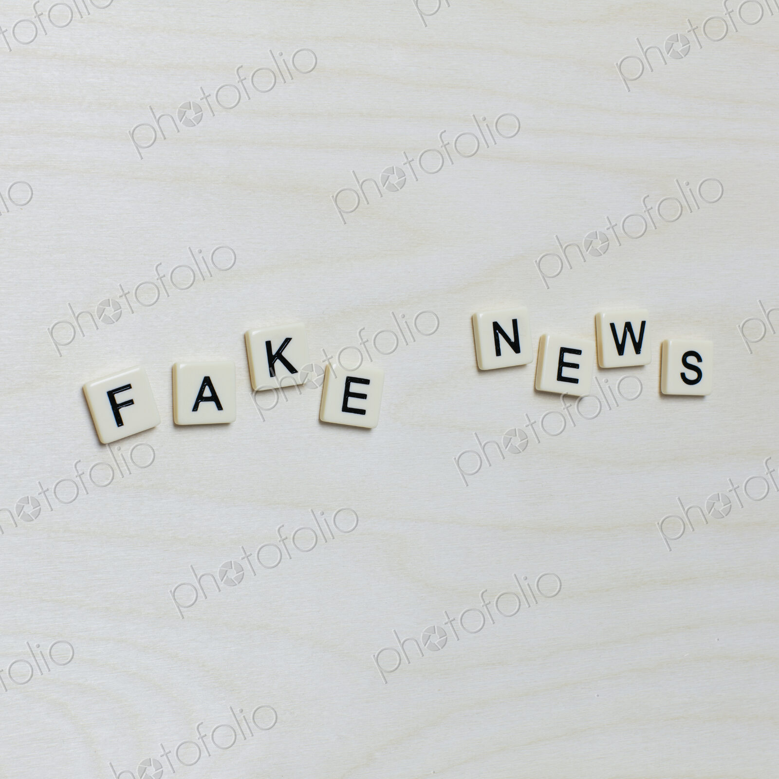 Letter blocks spelling “FAKE NEWS”
