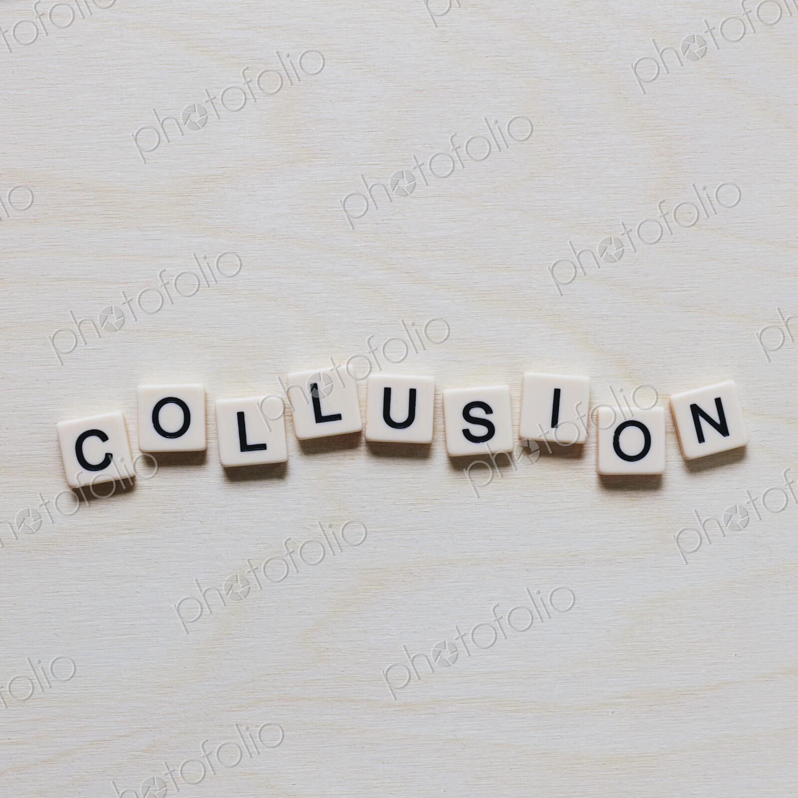 Letter blocks spelling the word COLLUSION