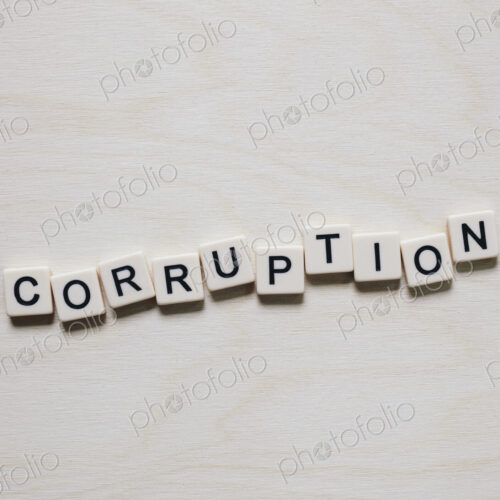 Letter blocks spelling the word CORRUPTION Letter blocks spelling the word CORRUPTION