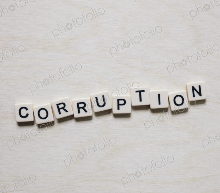 Letter blocks spelling the word CORRUPTION