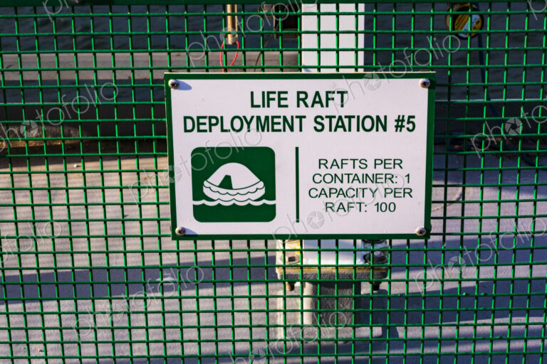 Life raft deployment station sign on a ferry in Seattle, an information sign.