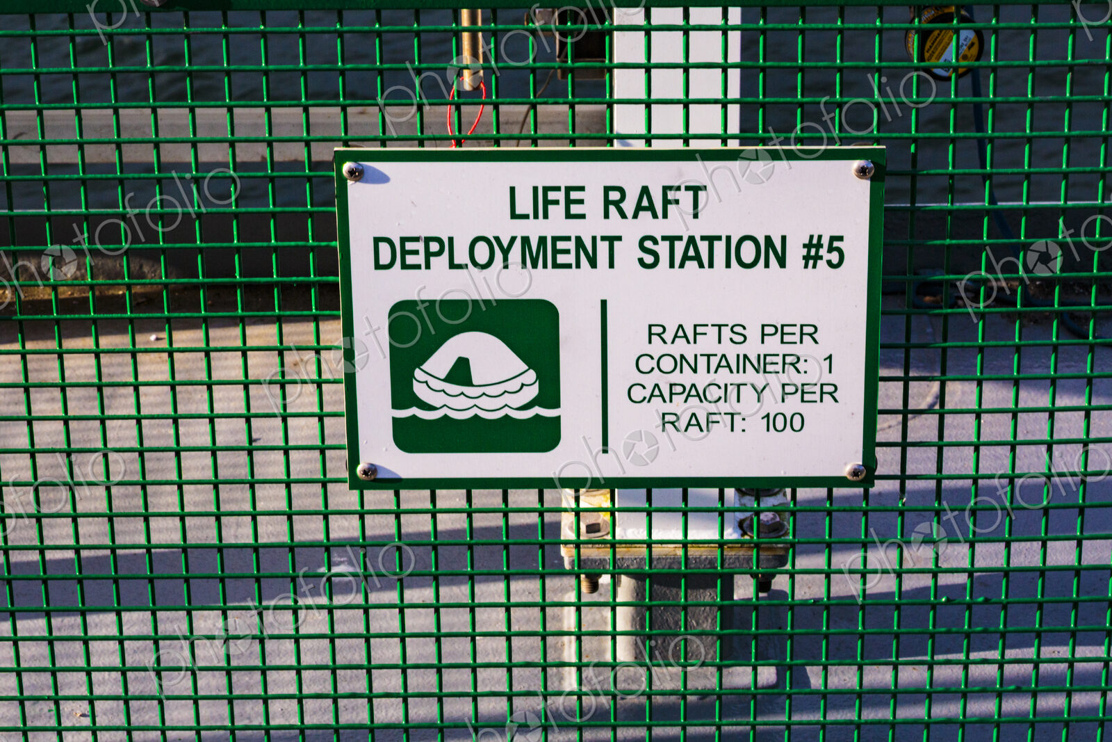 Life raft deployment station sign on a ferry in Seattle, an information sign.