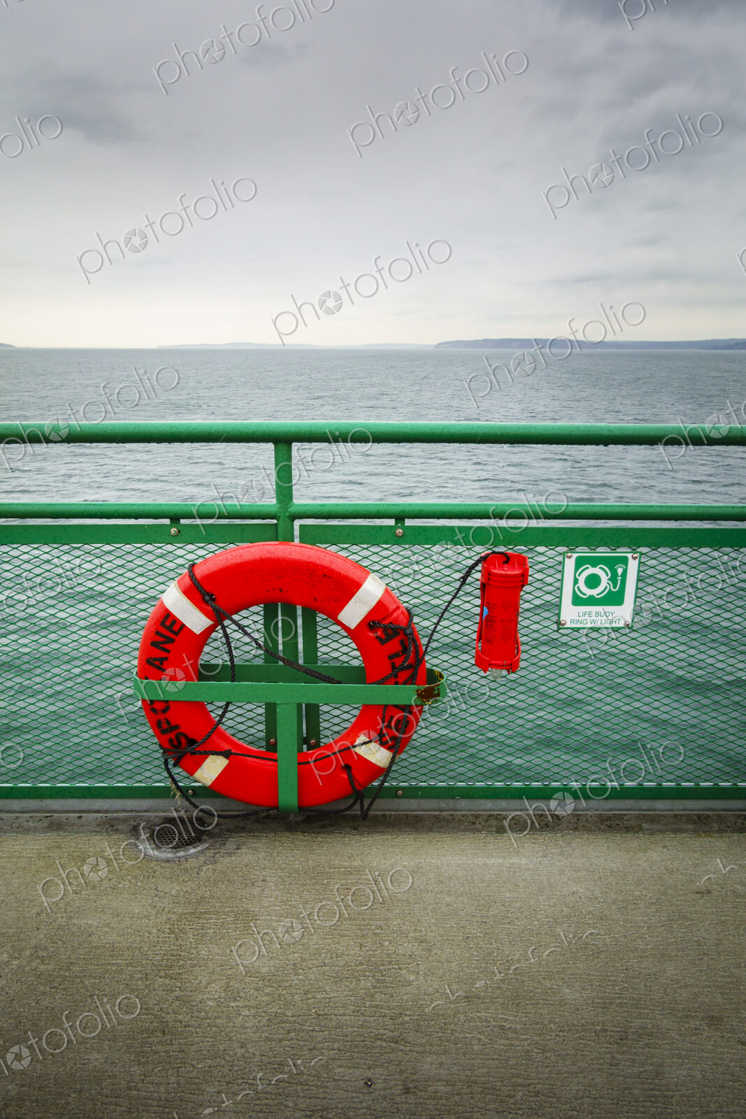 Life ring on railing of a Puget Sound ferry crossing from Edmonds to Kingston, WA USA