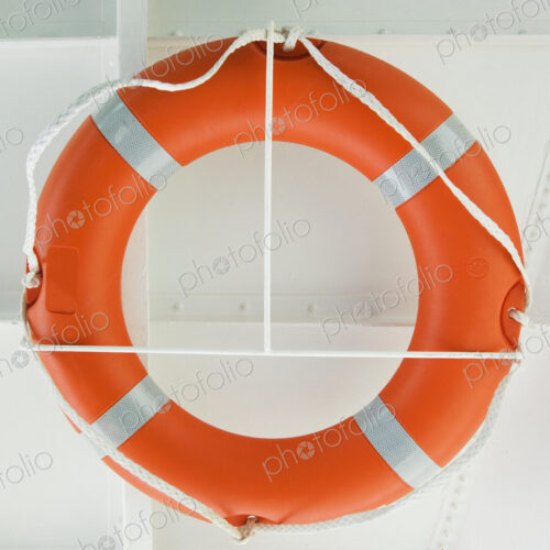 Life ring on wall of ship. Life ring on wall of ship.