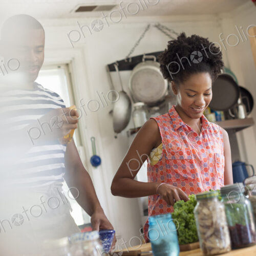 Lifestyle. Two people working in a farmhouse kitchen.