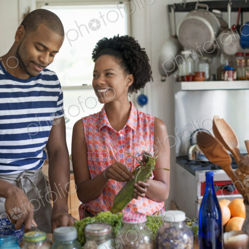 Lifestyle. Two people working in a farmhouse kitchen.