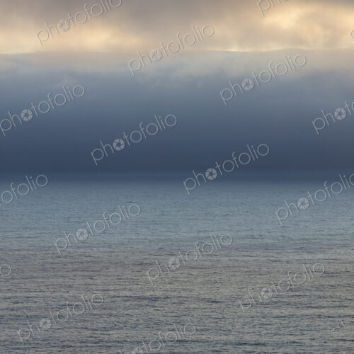 Lifting clouds and fog over vast ocean Lifting clouds and fog over vast ocean