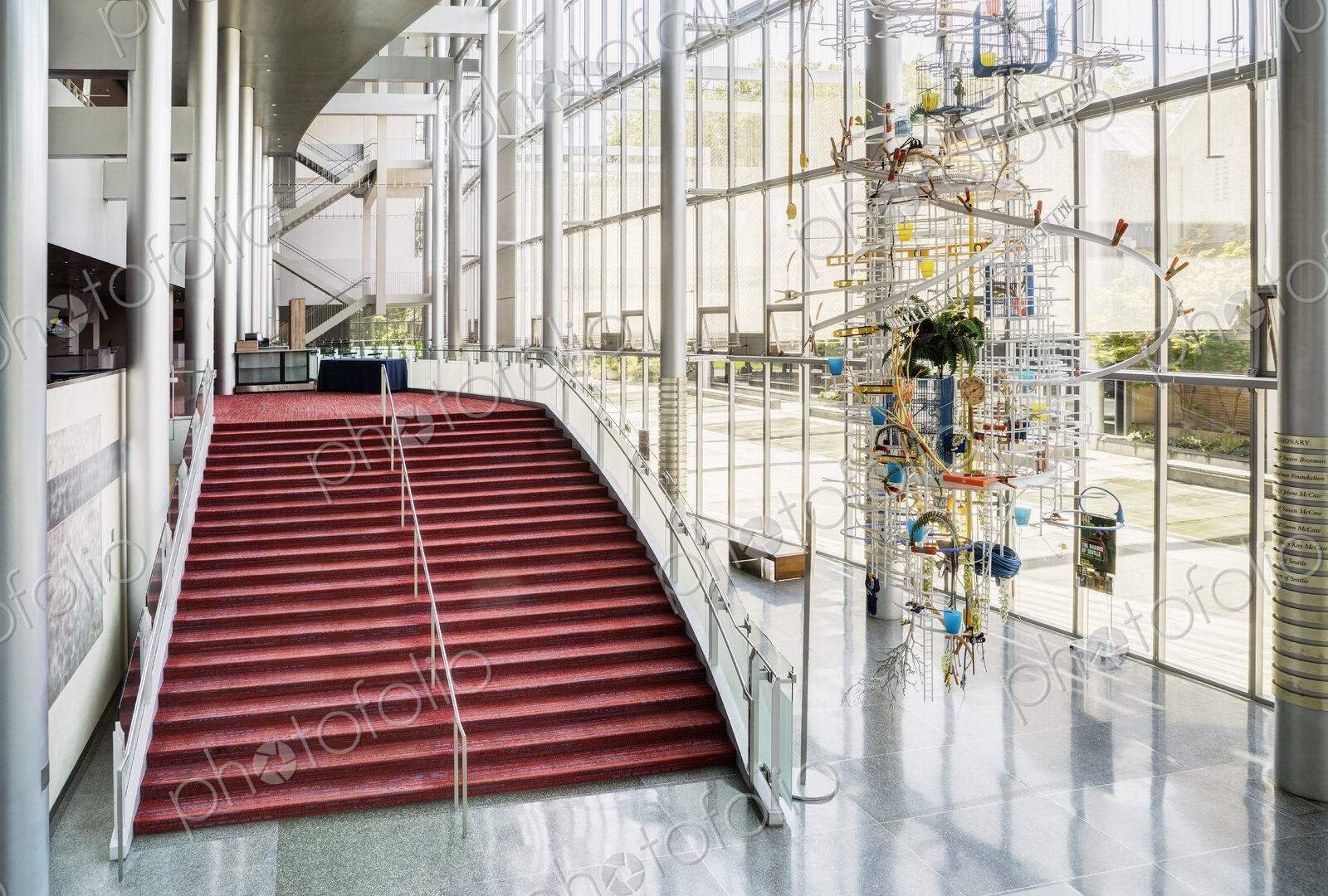 Light and airy atrium of a modern building with marble floors.