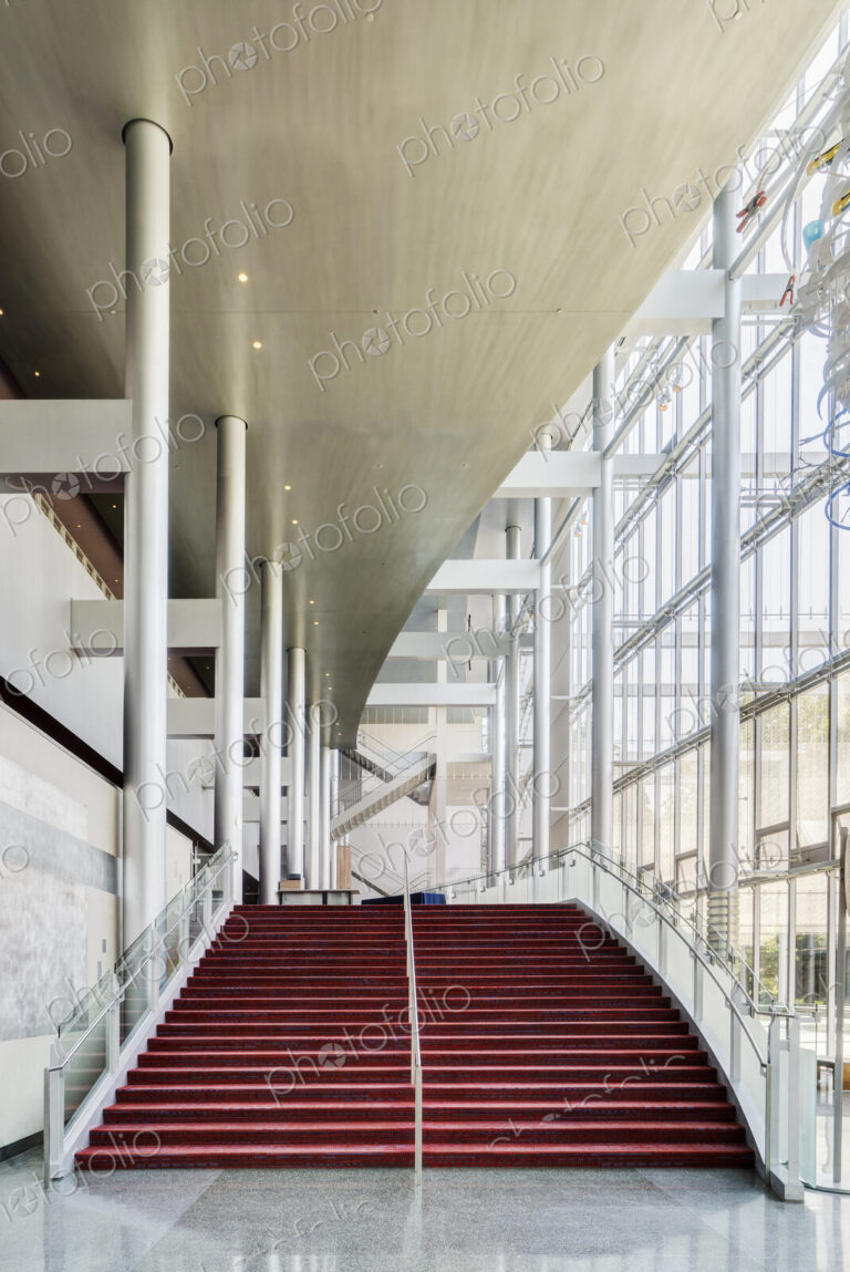 Light and airy atrium of a modern building with marble floors.