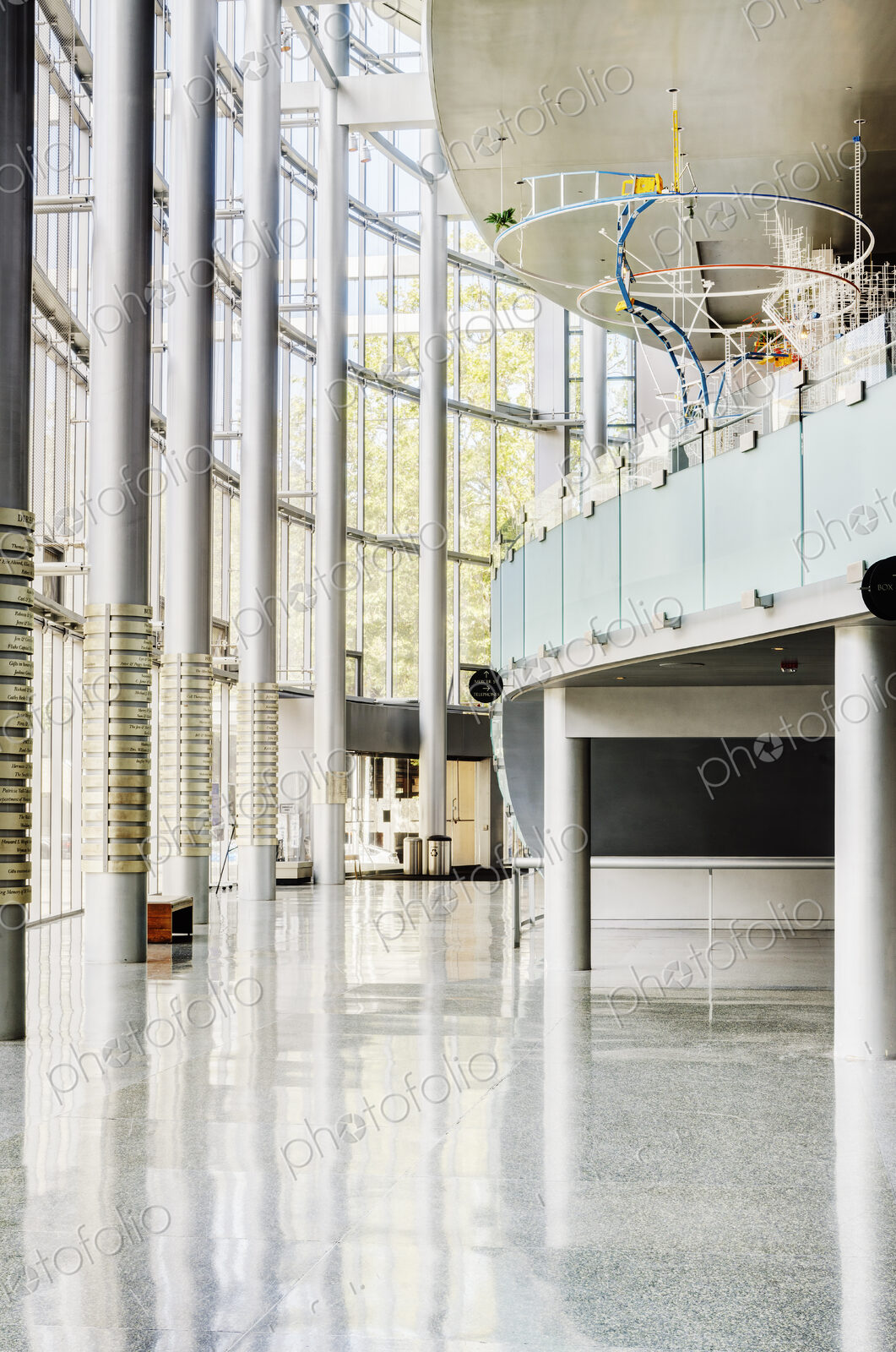 Light and airy atrium of a modern building with marble floors.