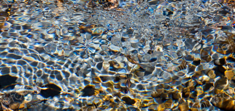 Light and shadow on ripples in a shallow section of the Sol Duc River, Olympic…