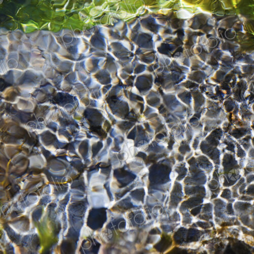 Light and shadow on ripples in a shallow section of the Sol Duc River, Olympic… Light and shadow on ripples in a shallow section of the Sol Duc River, Olympic…