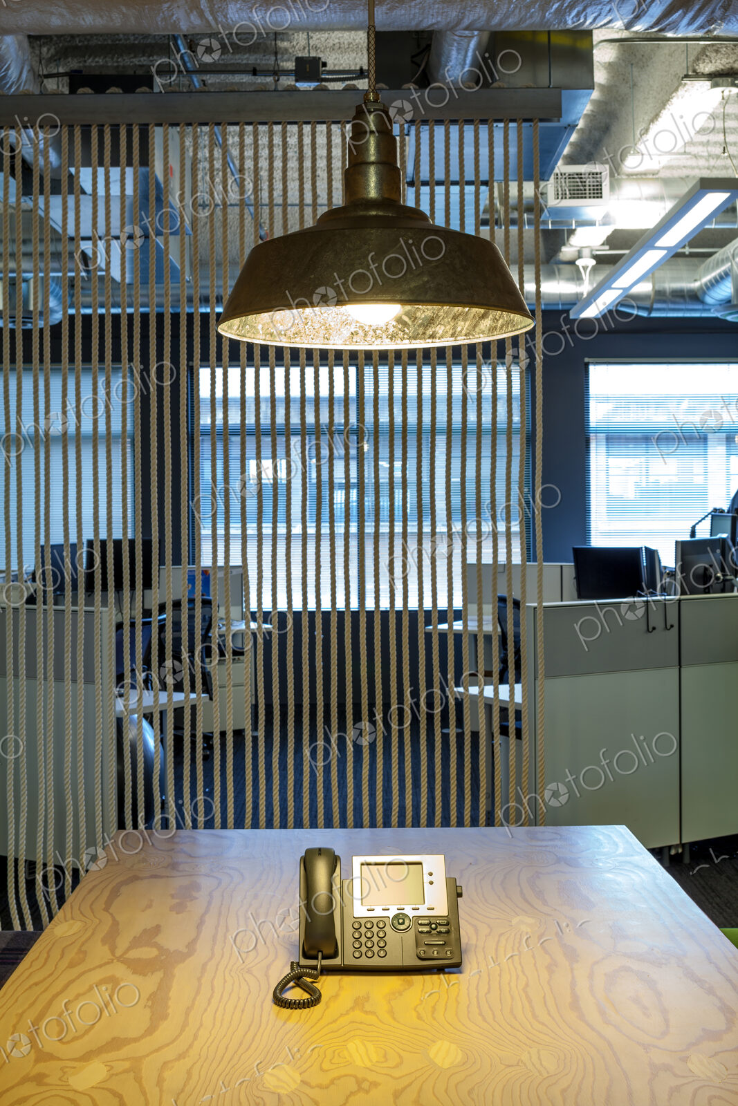 Light fixture over phone in office conference room