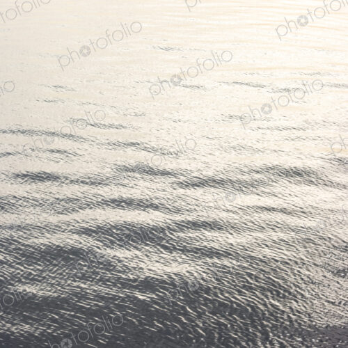 Light ripples on water, natural patterns and sunlight. Light ripples on water, natural patterns and sunlight.