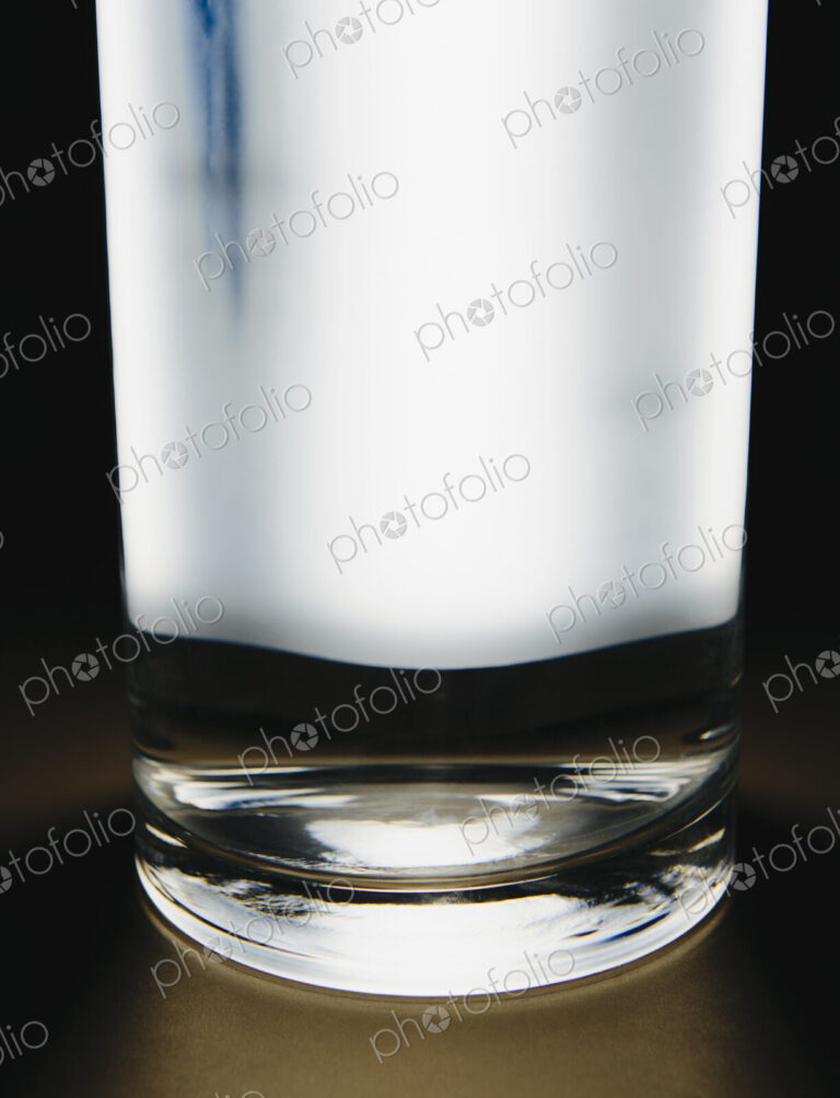 Light shining through glass of filtered water.
