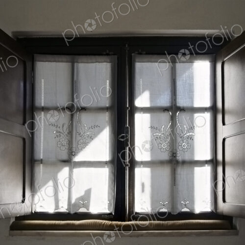 Light streaming through lace curtains Light streaming through lace curtains
